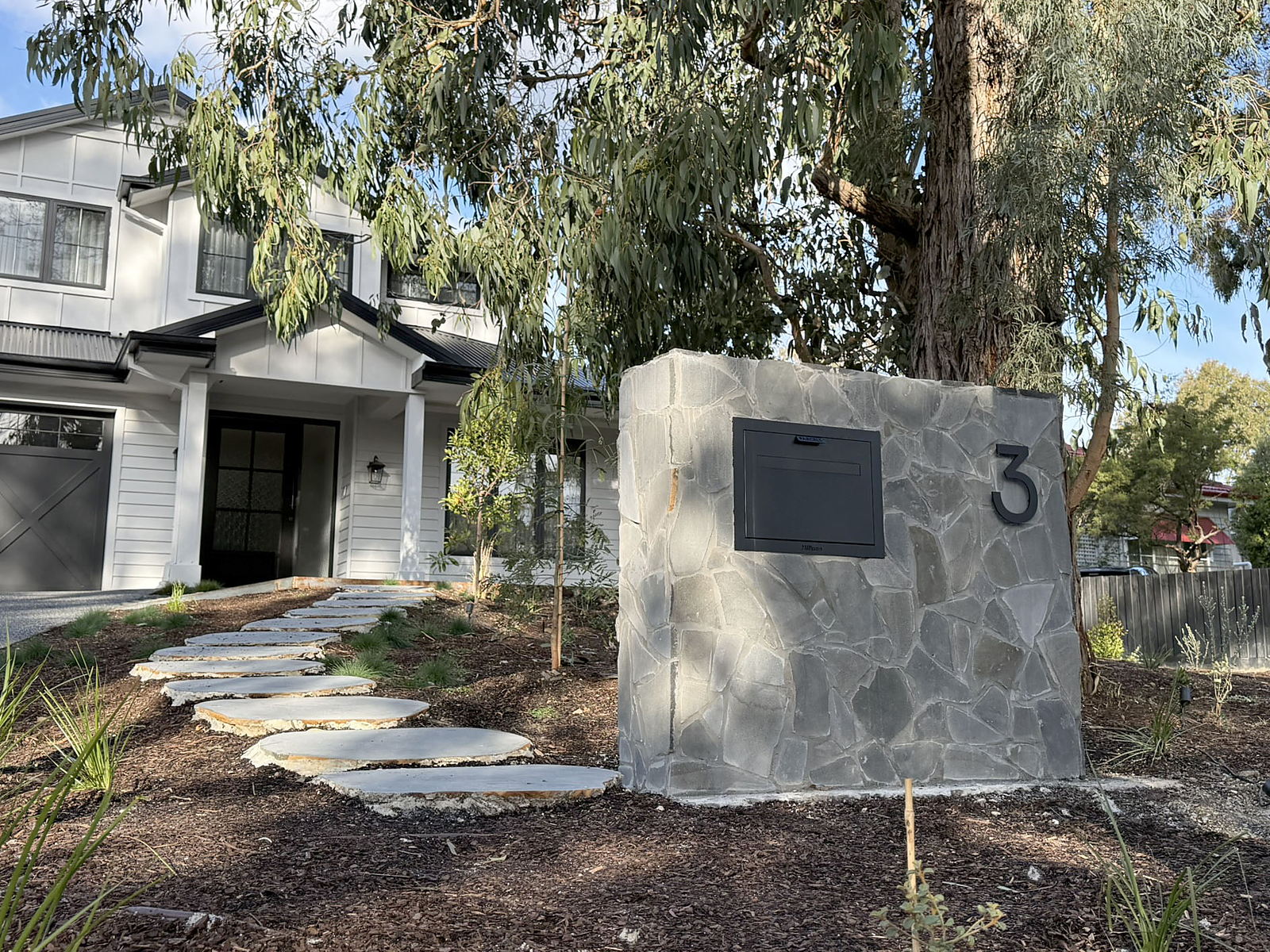 Forest Hill front garden with a custom crazy-paved bluestone postbox