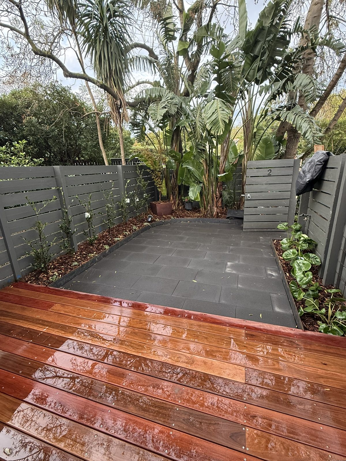 Kew — Ironbark deck with corten edging and charcoal paving