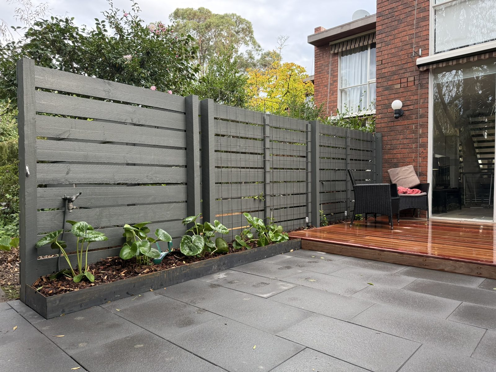 Kew — timber boundary screening with corten-edged garden bed